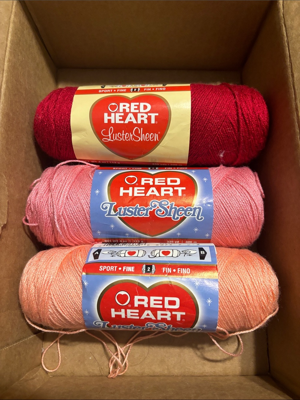 Red Heart Luster Sheen Yarn Trio - Red, Pink, Peach